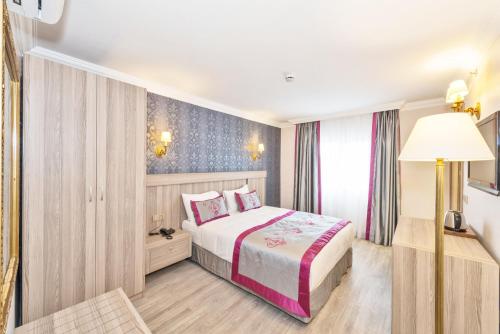 Una cama o camas en una habitación de Dab Hotel