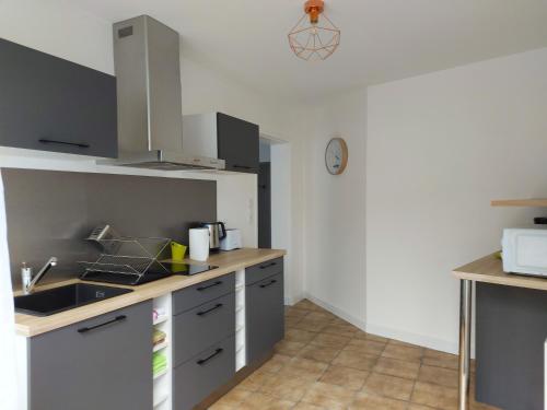 a kitchen with a sink and a counter top at Choletais forever... in Cholet