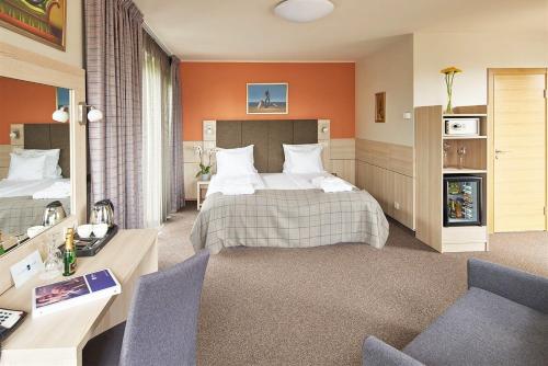 Säng eller sängar i ett rum på Wellton Riga Hotel & SPA