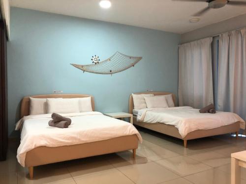 Tempat tidur dalam kamar di Cloud Stay at Setia Alam