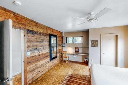 a living room with a wooden wall at East 6th Historic Loft in Austin