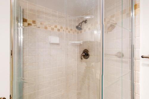a bathroom shower with a glass shower door at Sea Colony - Dover House in Bethany Beach