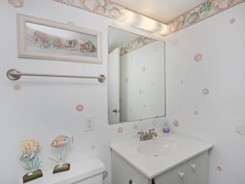 a bathroom with a sink and a mirror at Sea Colony Brandywine House II in Bethany Beach