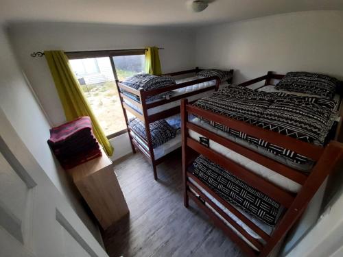 Postel nebo postele na pokoji v ubytování Cabañas Costa las Dichas