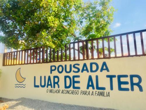 a sign at the entrance to pucadalah be albermia at Pousada Luar de Alter in Alter do Chao