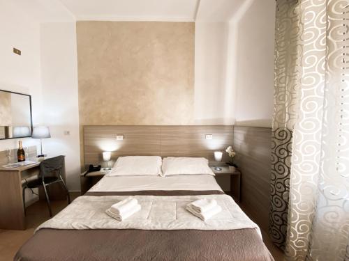 Postel nebo postele na pokoji v ubytování Hotel Colombo