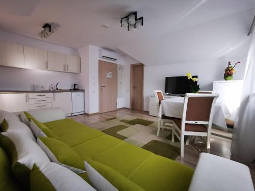 a living room with a couch and a table at Amso Residence in Sibiu