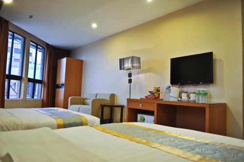 Giường trong phòng chung tại Hotel Centum