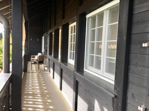 an empty hallway of a house with windows at Landhausvilla Strittberg 7 in Höchenschwand