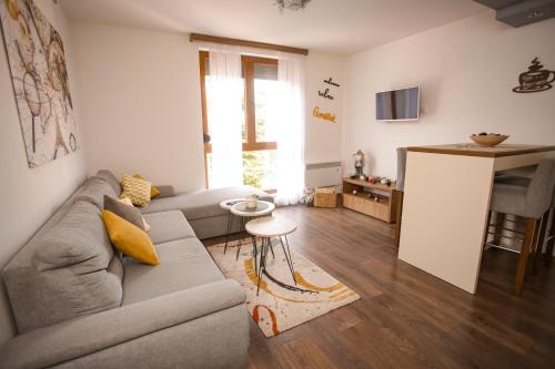 a living room with a couch and a table at Gorštak-Šeha in Jahorina