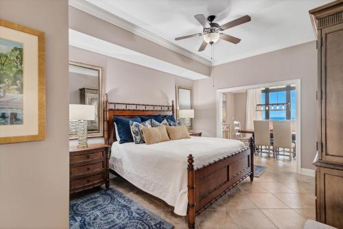 a bedroom with a bed and a ceiling fan at The Oasis at Orange Beach (formerly Phoenix West II) in Orange Beach