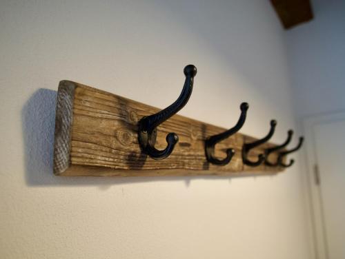 a wooden object hanging on a wall at Bärengasse Apartments in Freinsheim
