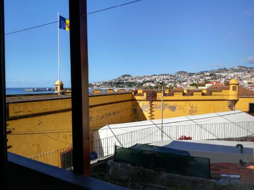 a view of a city from a window of a building at Casa Zona Velha - Caetano in Funchal