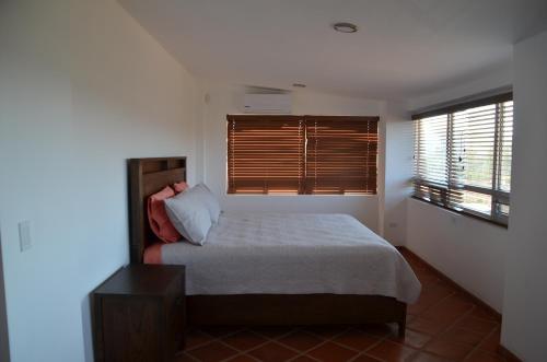 מיטה או מיטות בחדר ב-Finca Jorsan