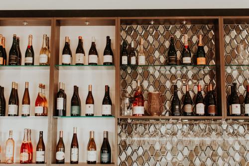 a bunch of bottles of wine on shelves at Wine Stone Inn in Santa Maria