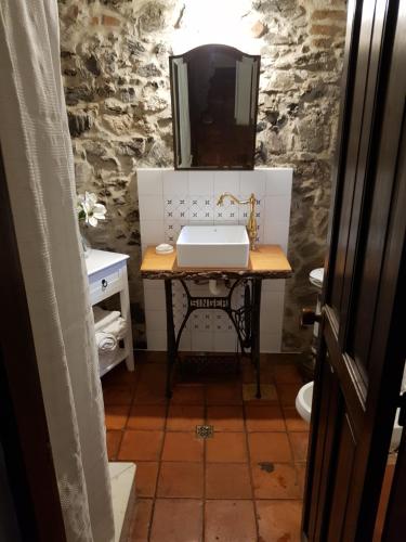 a bathroom with a sink and a mirror at Bajo el Faro in Colonia del Sacramento