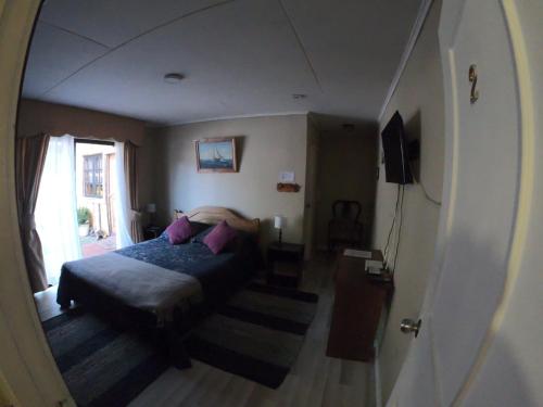Postel nebo postele na pokoji v ubytování Hostal Los Guindos