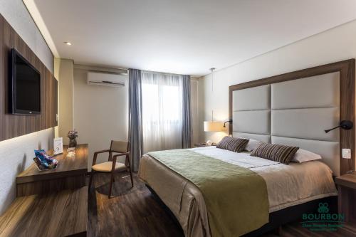 Llit o llits en una habitació de Bourbon Dom Ricardo Aeroporto Curitiba Business Hotel