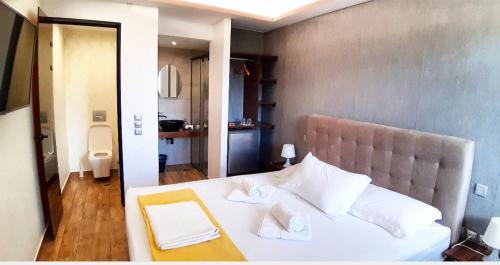 Postelja oz. postelje v sobi nastanitve Villa Park Luxury Rooms