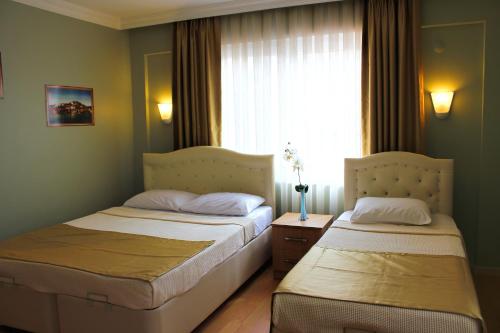 Katil atau katil-katil dalam bilik di Hotel Dost