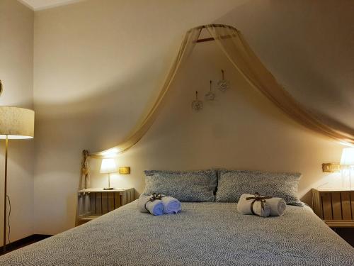 Кровать или кровати в номере Regina di Cuori Rooms