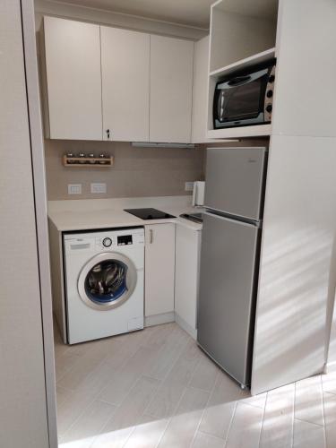 Dapur atau dapur kecil di Migdal Luxury Suites Netanya J29