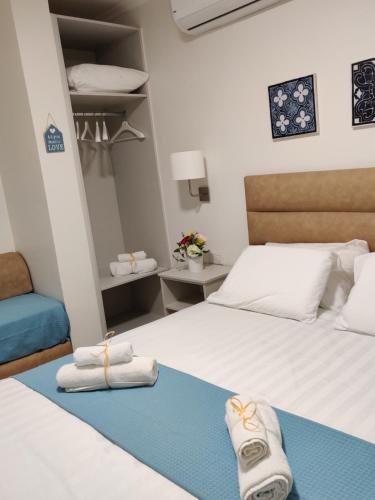 Katil atau katil-katil dalam bilik di Migdal Luxury Suites Netanya J29