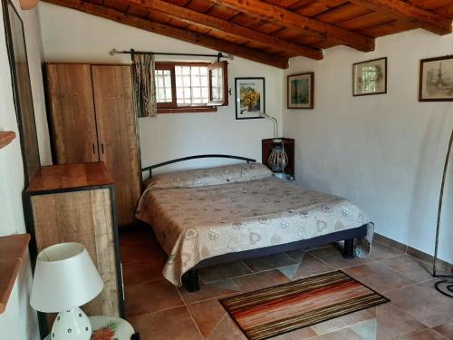 Un pat sau paturi într-o cameră la Casa Rustica Lentini