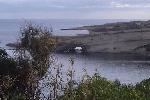 a body of water with a hole in the side of it at Merzuq House in Birżebbuġa