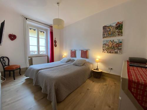 Кровать или кровати в номере L'Ours de Colmar - Appartements en centre ville