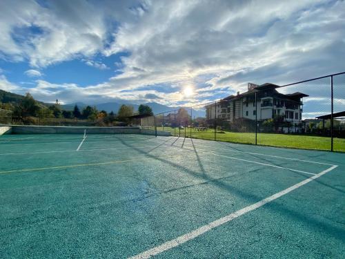 a tennis court with a tennis racket on it at Hotel Orbel in Dobrinishte