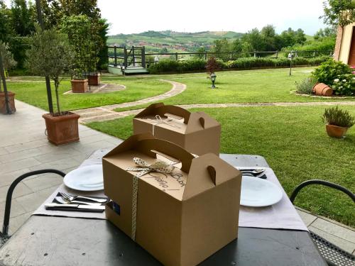a table with two cardboard boxes on top of it at Lange in Priocca