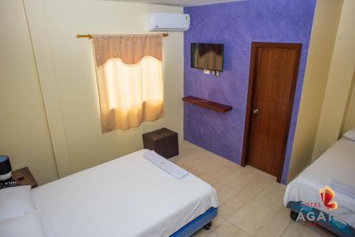 En eller flere senge i et værelse på Hotel Ágata Manta