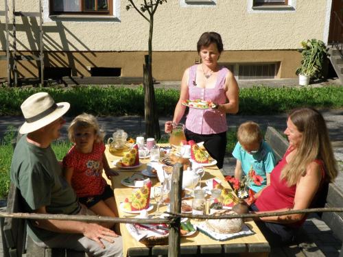a group of people sitting around a table eating food at Prinzenhof in Grossgerungs