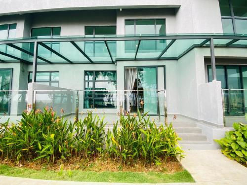 a building with glass doors and plants at Kuantan Imperium by Glex in Kuantan