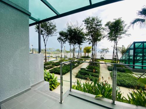 a view of a garden from the balcony of a building at Kuantan Imperium by Glex in Kuantan