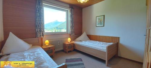 Kama o mga kama sa kuwarto sa Apartment Panoramablick by FiS - Fun in Styria