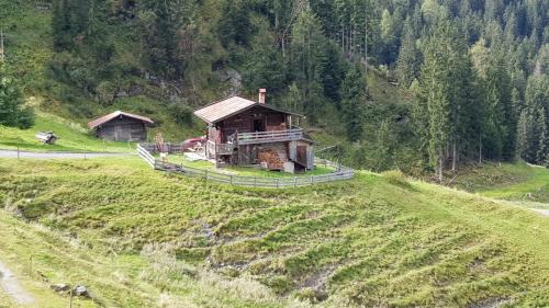 a house on the side of a hill at Almhütte Andrea in Wildschönau