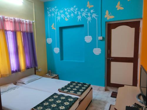 Postel nebo postele na pokoji v ubytování Hotel Ayodhya