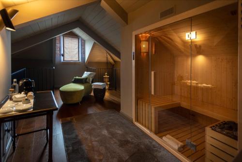 an attic bathroom with a shower and a sink at Dimora Cordero in Priocca