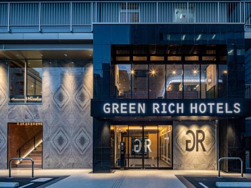 a building with a green rich hotels sign on it at Green Rich Hotel Kobe Sannomiya (Artificial hot spring Futamata Yunohana) in Kobe