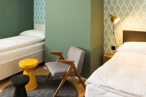 Postel nebo postele na pokoji v ubytování ADLER Boutique Hotel