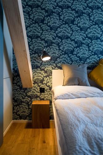 Postel nebo postele na pokoji v ubytování ADLER Boutique Hotel