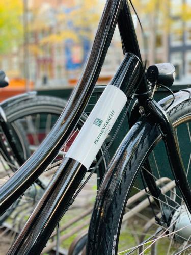 a bike with a bottle on the front wheel at Prinsengracht Hotel in Amsterdam