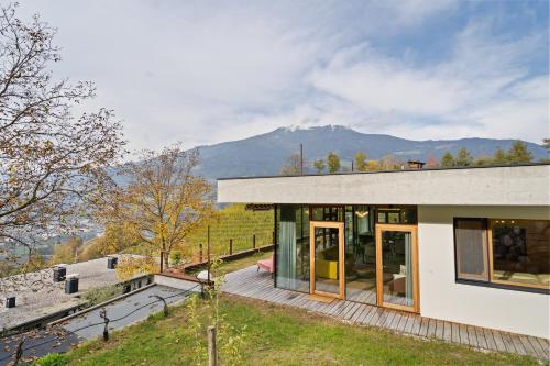 a house with a view of the mountains at Villa Vogelnest in Bressanone