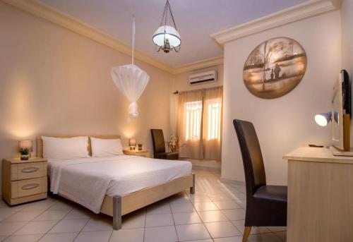 Кровать или кровати в номере Seaview Gardens Hotel