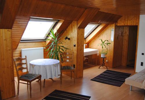 a room with a table and two windows at Alt Weeze in Weeze