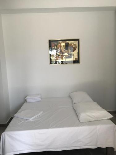 Postel nebo postele na pokoji v ubytování KoNaKaRi Garden