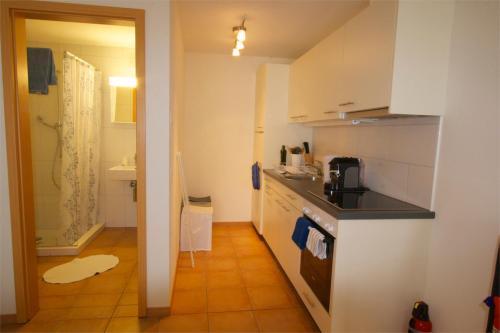 a kitchen with a sink and a counter top at Chalet Mack in Brienzwiler