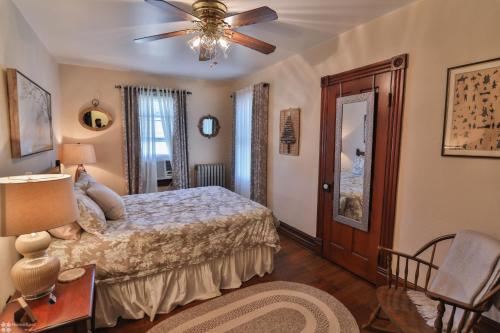 a bedroom with a bed and a ceiling fan at Lizard Creek Inn in Andreas